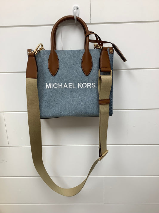 Michael Kors Mirella Small Denim Crossbody Bag in a blue washed denim material with brown leather trim